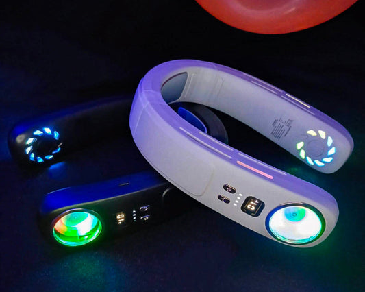 Wandergust wearable neck fans glowing under UV light with RGB features and festival balloons